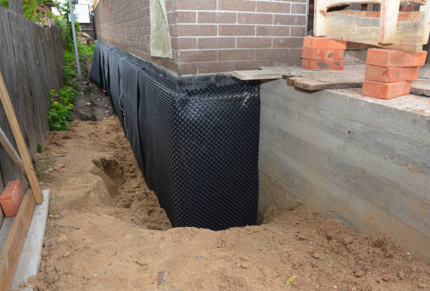 Happy homeowners after waterproofing job in Donaldson